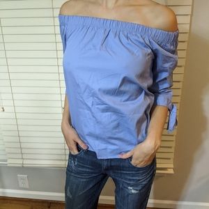 Light blue open shoulders shirt